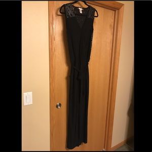 Black jumpsuit, wrap front, show through back
